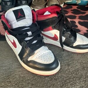Nike Air Jordan Black, Red, and White High Tops